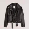 Black leather jacket on a light gray background