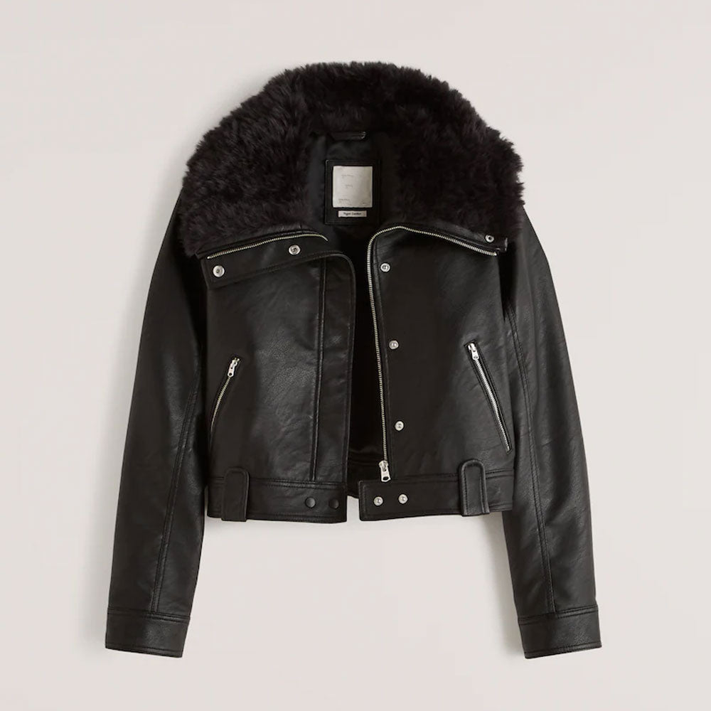 Black leather jacket with fur hood on a light gray background