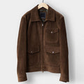 Brown suede jacket on a hanger against a white background