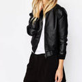Person wearing a black leather jacket on a white background
