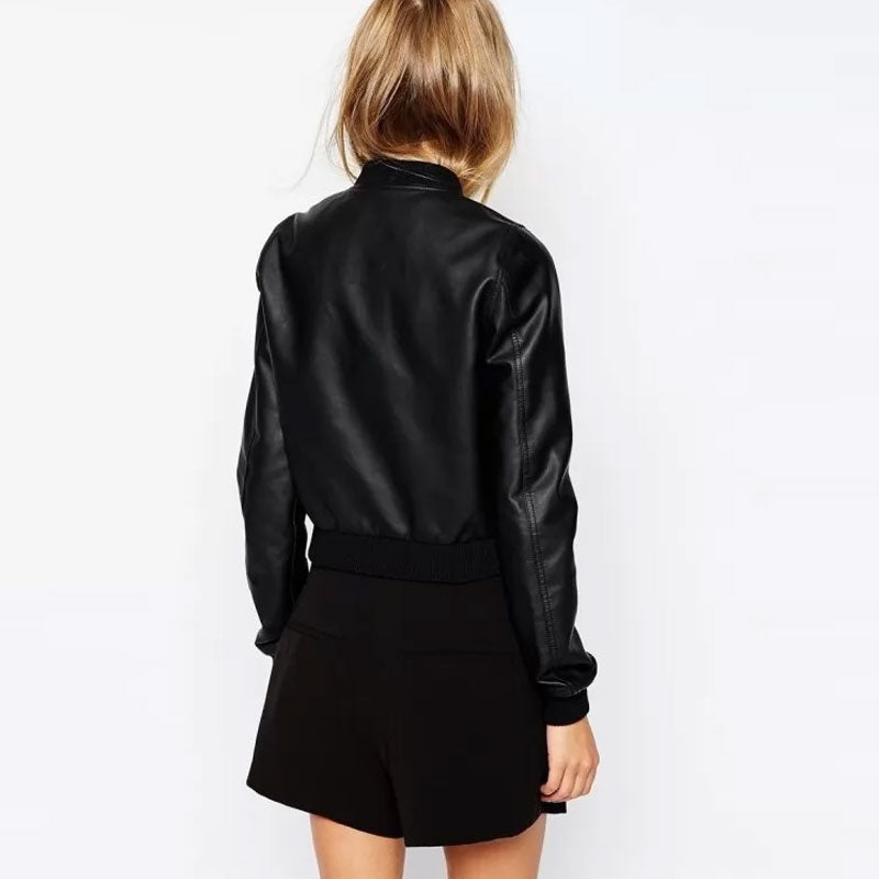 Person wearing a black leather jacket and shorts on a white background