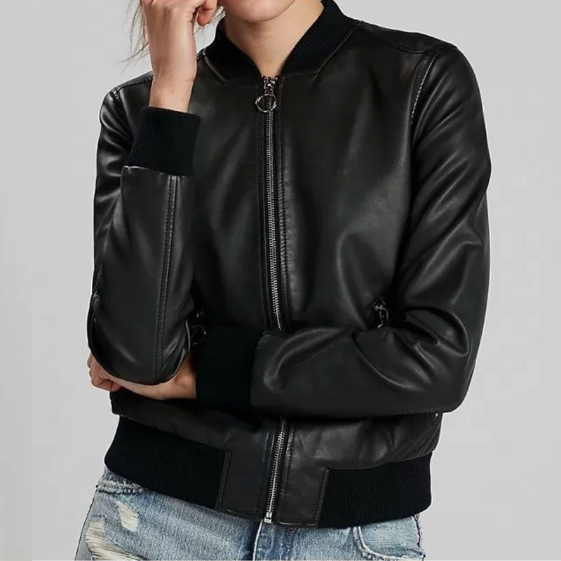 Black leather jacket worn by a person on a gray background