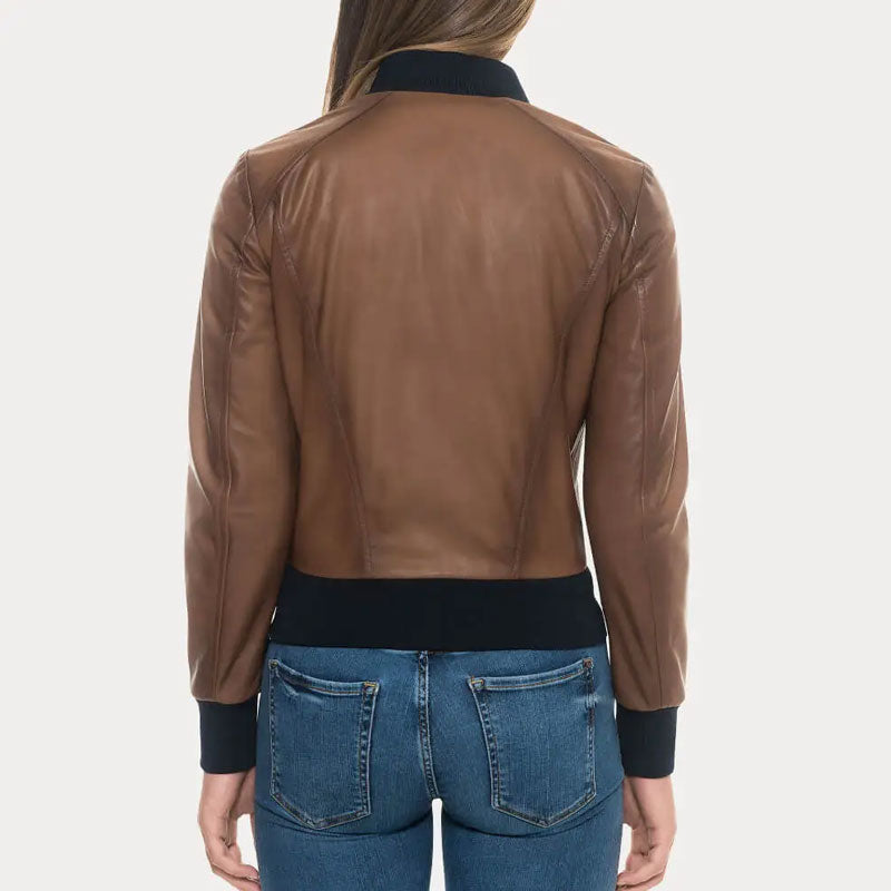 Brown leather jacket worn by a person on a white background