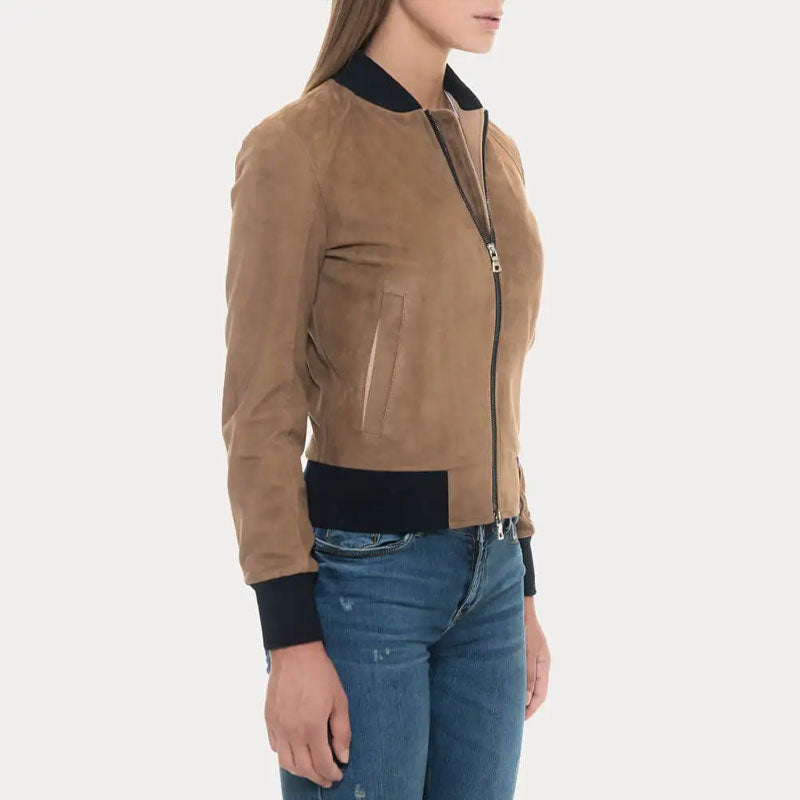 Person wearing a brown suede jacket with black accents on a white background