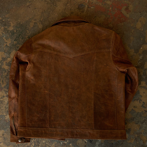 Brown leather jacket on a textured, multicolored background