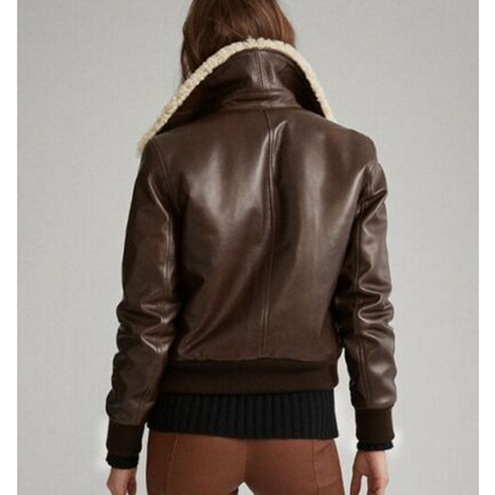Brown leather jacket with white fur lining on a gray background