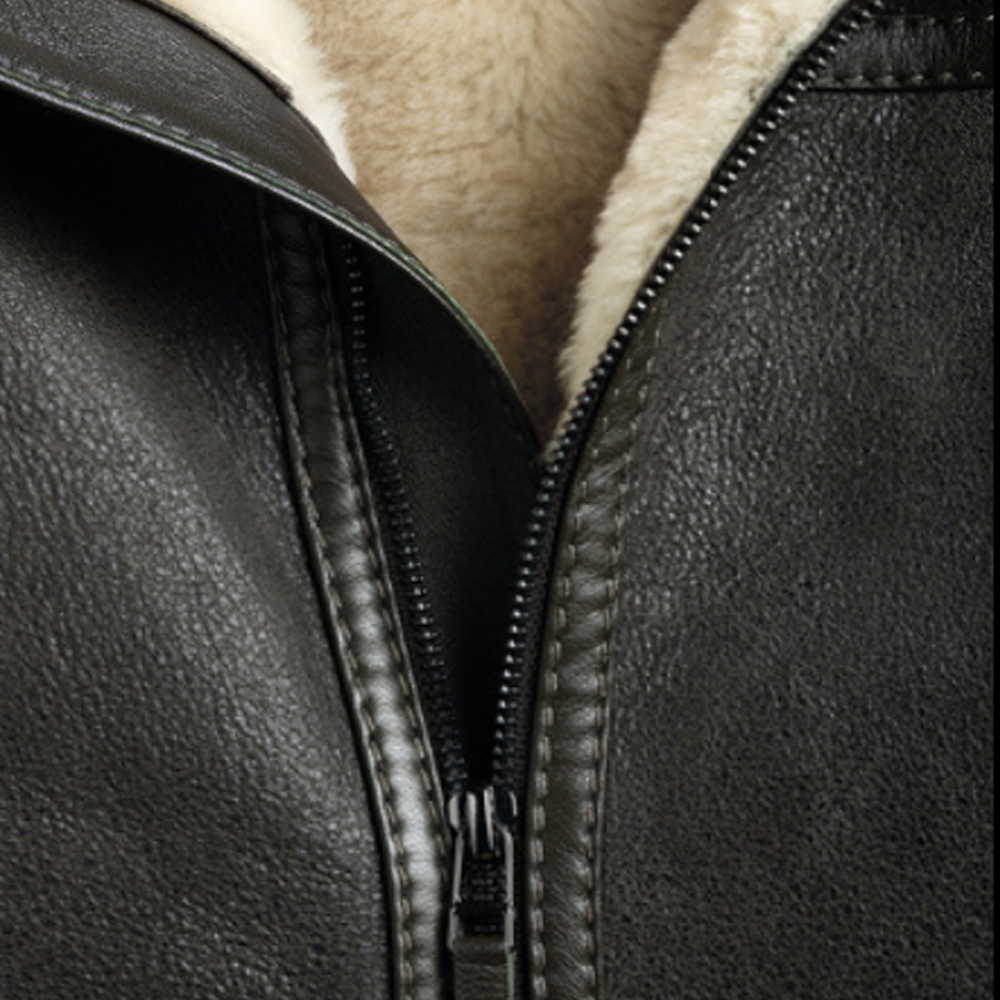 Close-up of a black leather jacket with a zipper