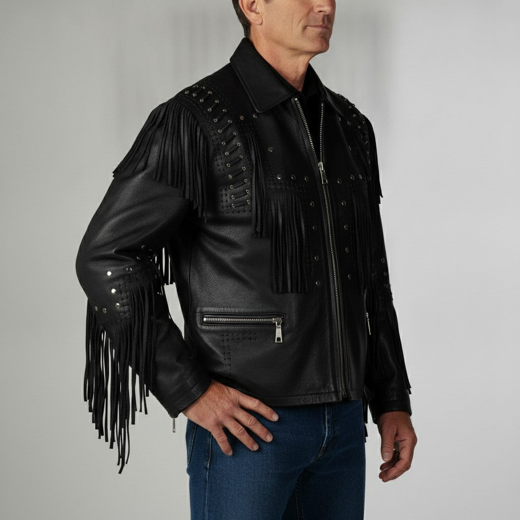 Man wearing a black leather jacket with fringe details on a gray background