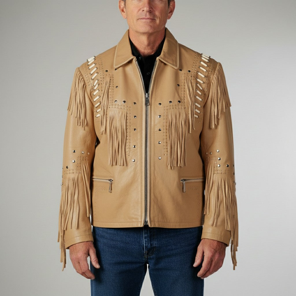 Man wearing a tan leather jacket with fringes and studs on a gray background
