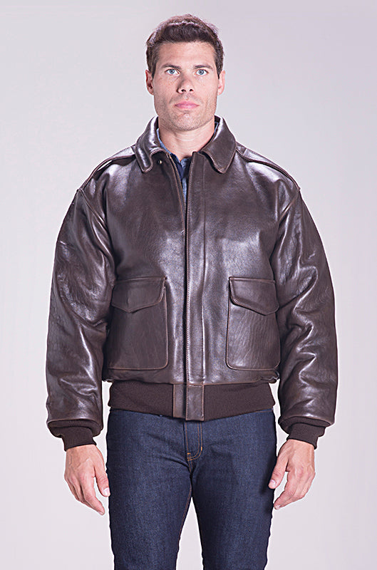 Man wearing a brown leather jacket on a plain background