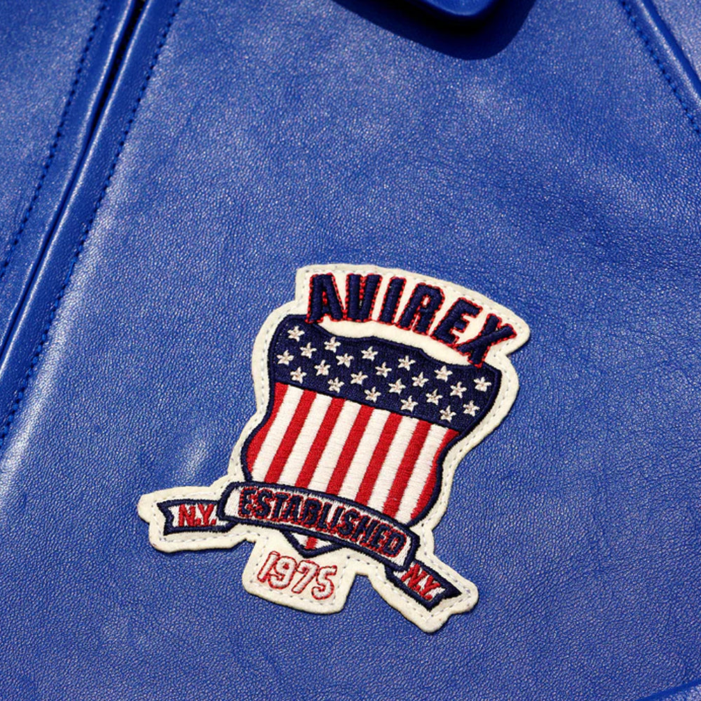 Blue jacket with a patch featuring an American flag and text on a blue background