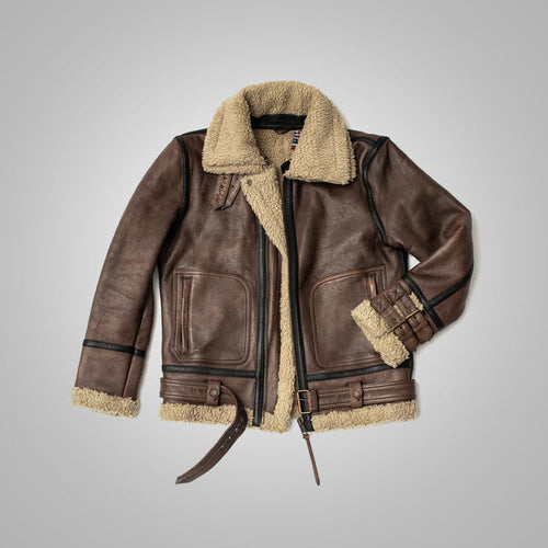 Brown leather jacket with shearling collar and cuffs on gray background