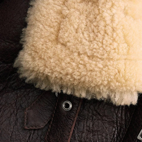 Close-up of a textured brown leather surface with a fluffy beige fur trim.