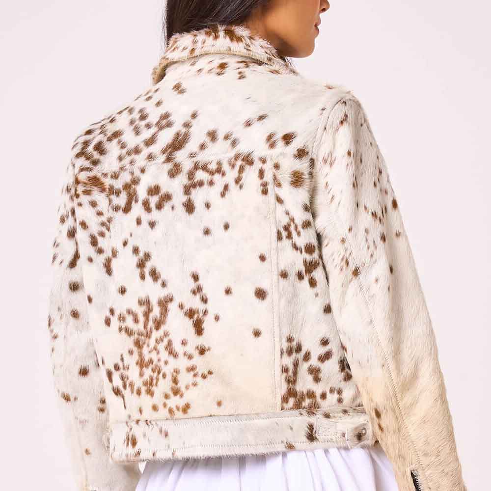 A cropped leather jacket with a brown and cream cowhide print, shown from the back on a model against a light background.