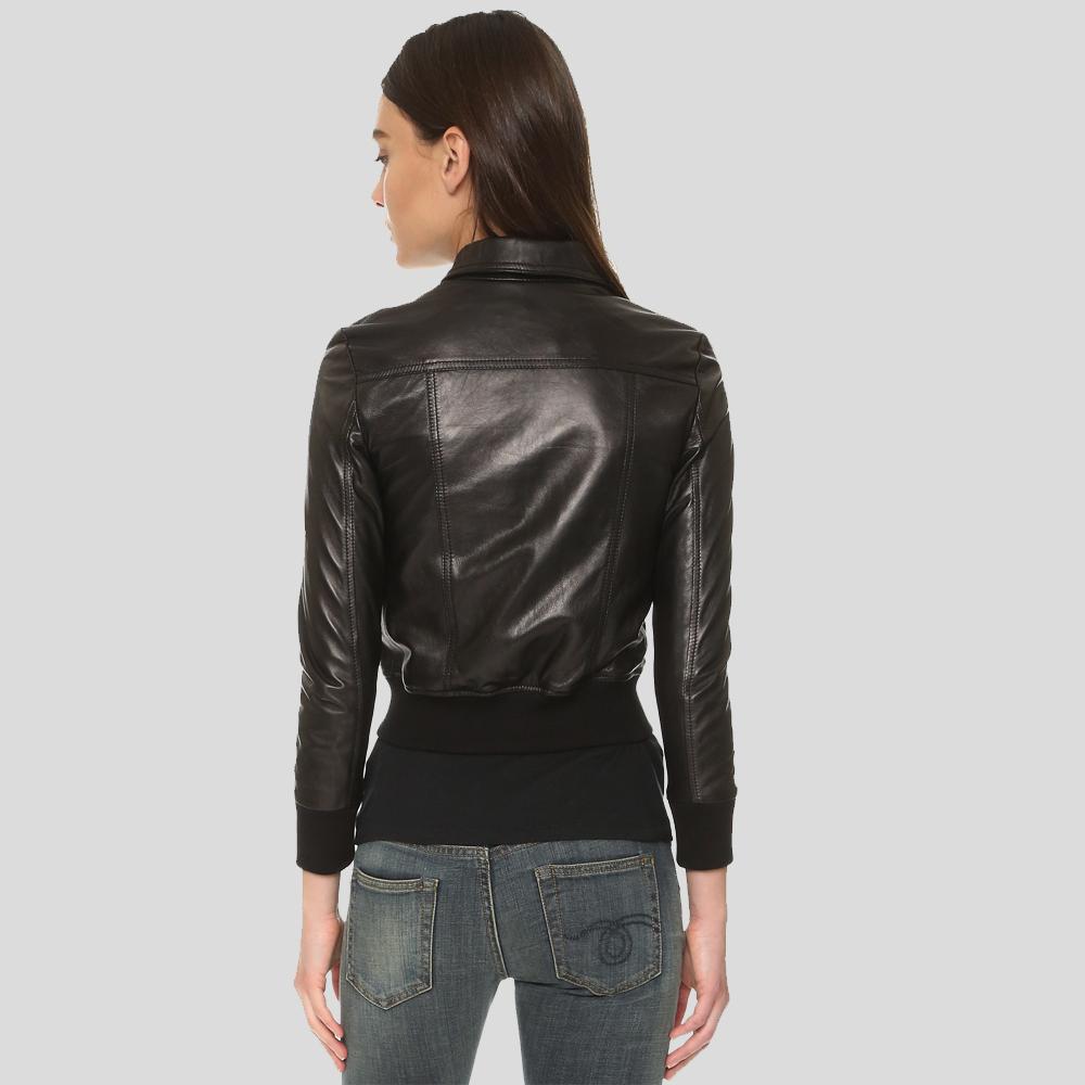 Person wearing a black leather jacket on a gray background