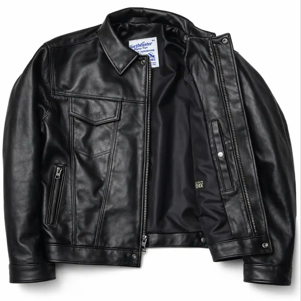 A black leather jacket with a zippered front, flap chest pockets, and zippered side pockets, shown against a plain white background.