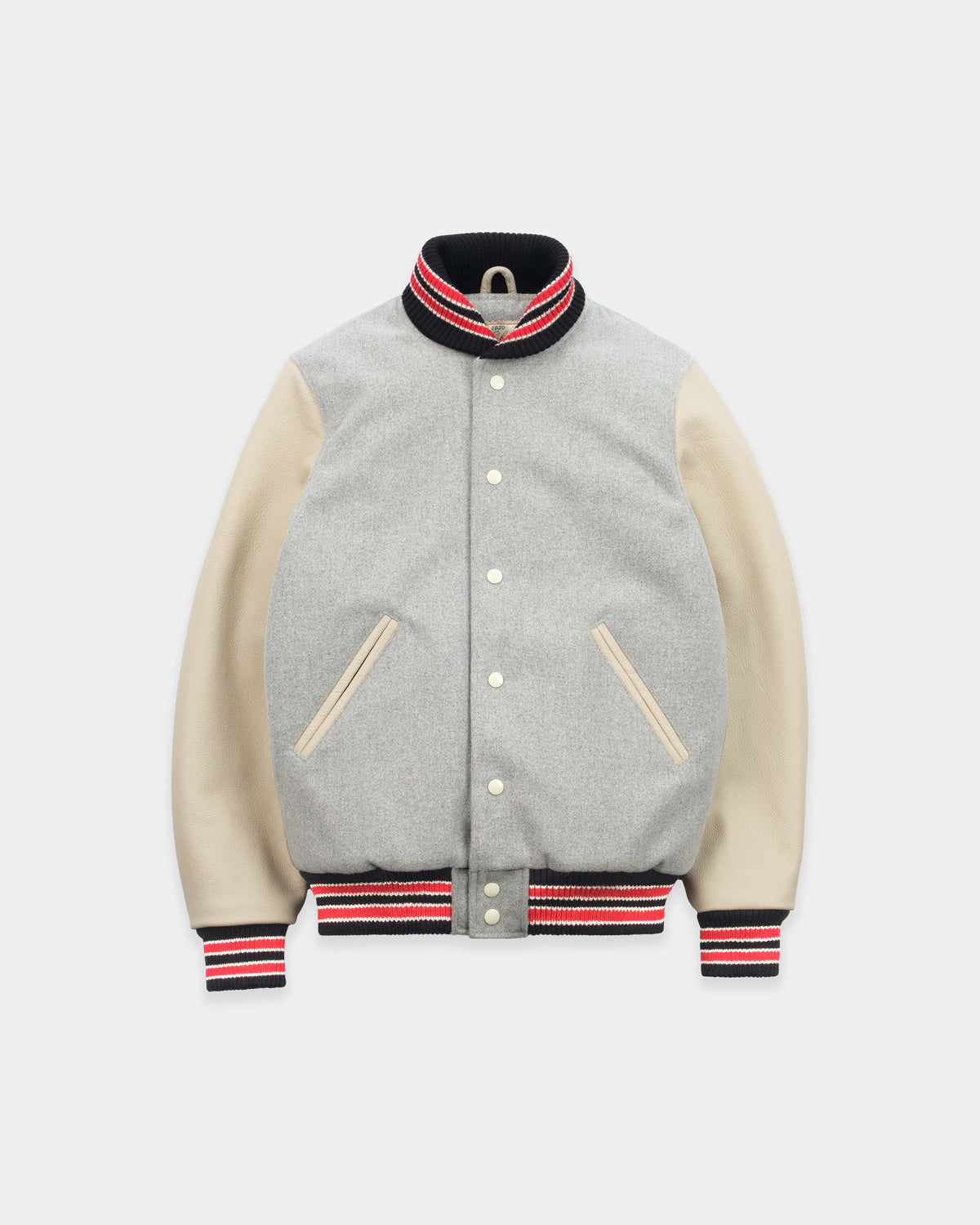 A varsity-style jacket with a light gray heathered body, beige sleeves, and black, red, and white striped ribbed trim on the collar, cuffs, and hem.