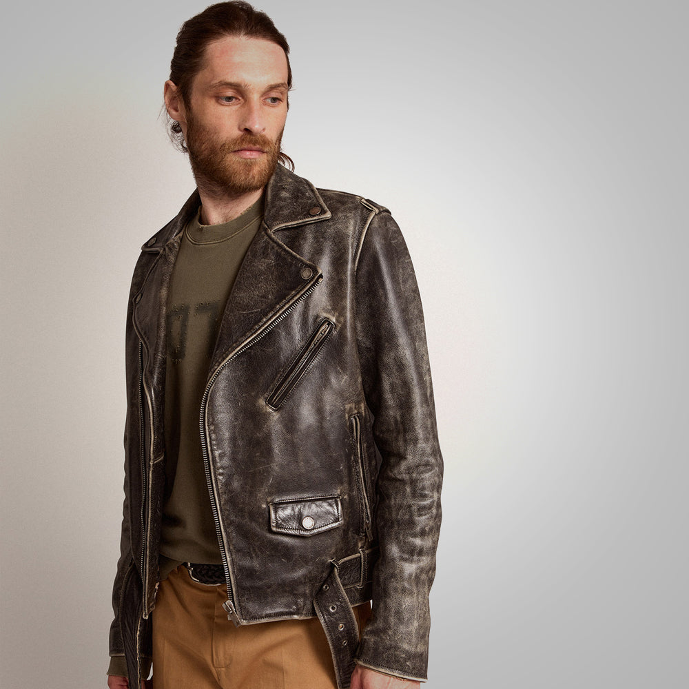Man wearing a brown leather jacket on a plain background