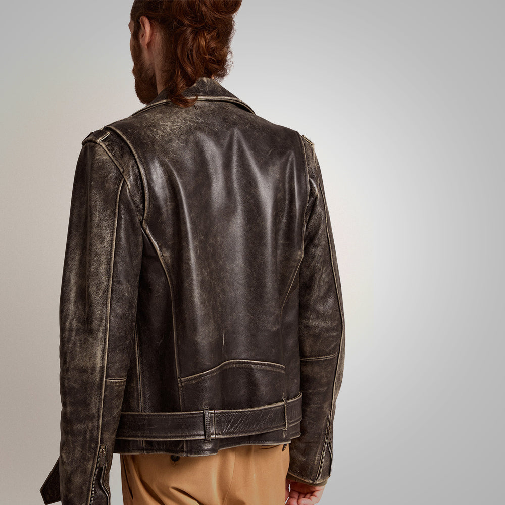 Man wearing a dark brown leather jacket on a plain background