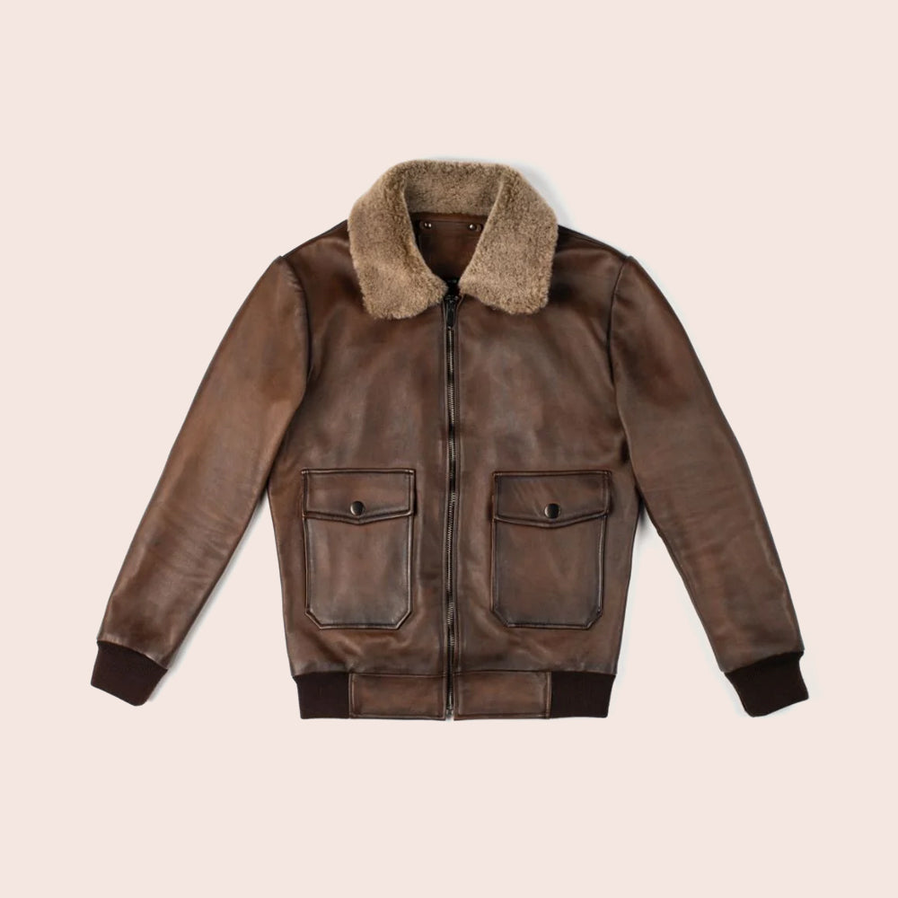 Brown leather jacket with fur collar on a beige background