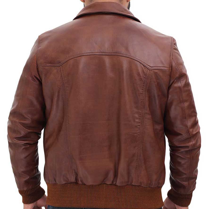 Brown leather jacket worn by a person on a white background