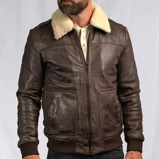 Brown leather jacket with beige fur lining on a plain background
