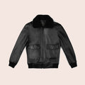Black leather jacket with fur collar on a beige background