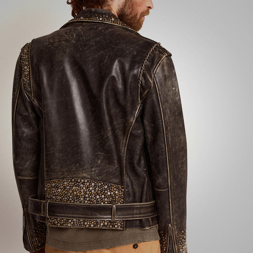 Brown leather jacket with decorative elements on a neutral background