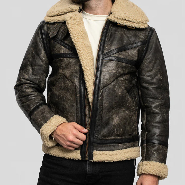 Brown leather jacket with beige fur lining on a gray background