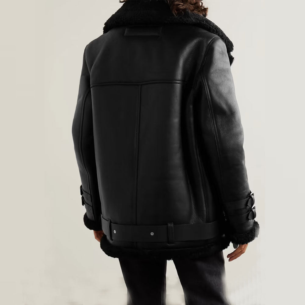 Black leather jacket with fur trim on a neutral background
