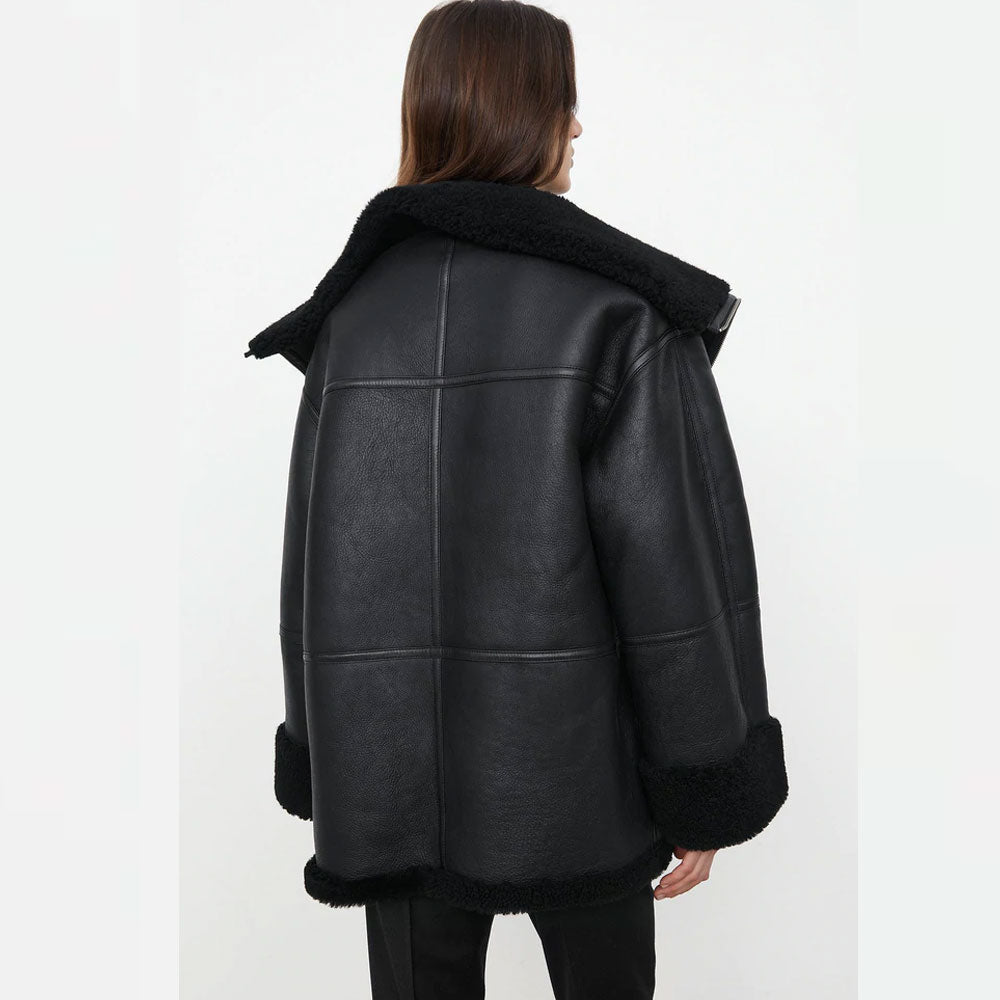 Black leather coat with fur trim on a white background