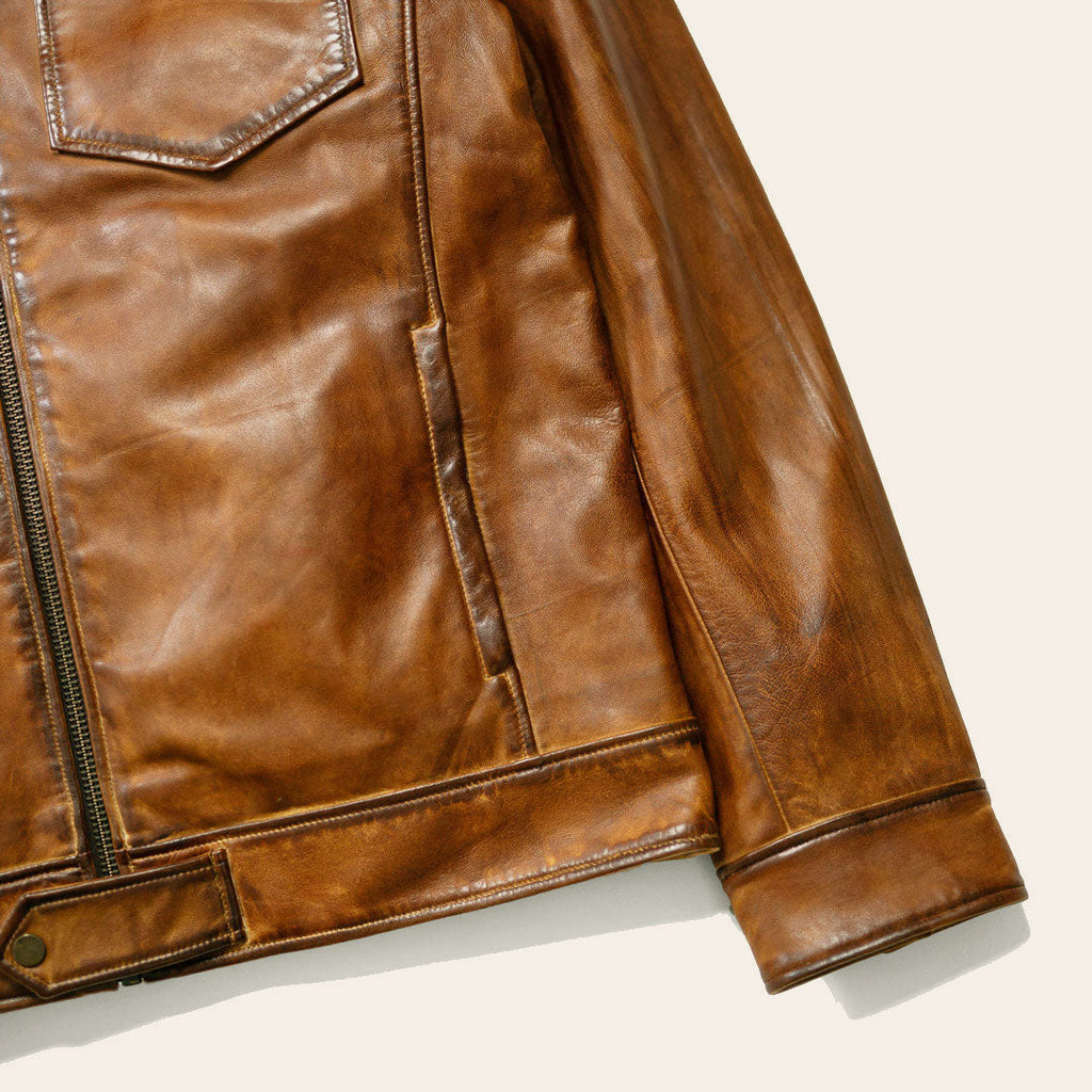 Brown leather jacket on a light background