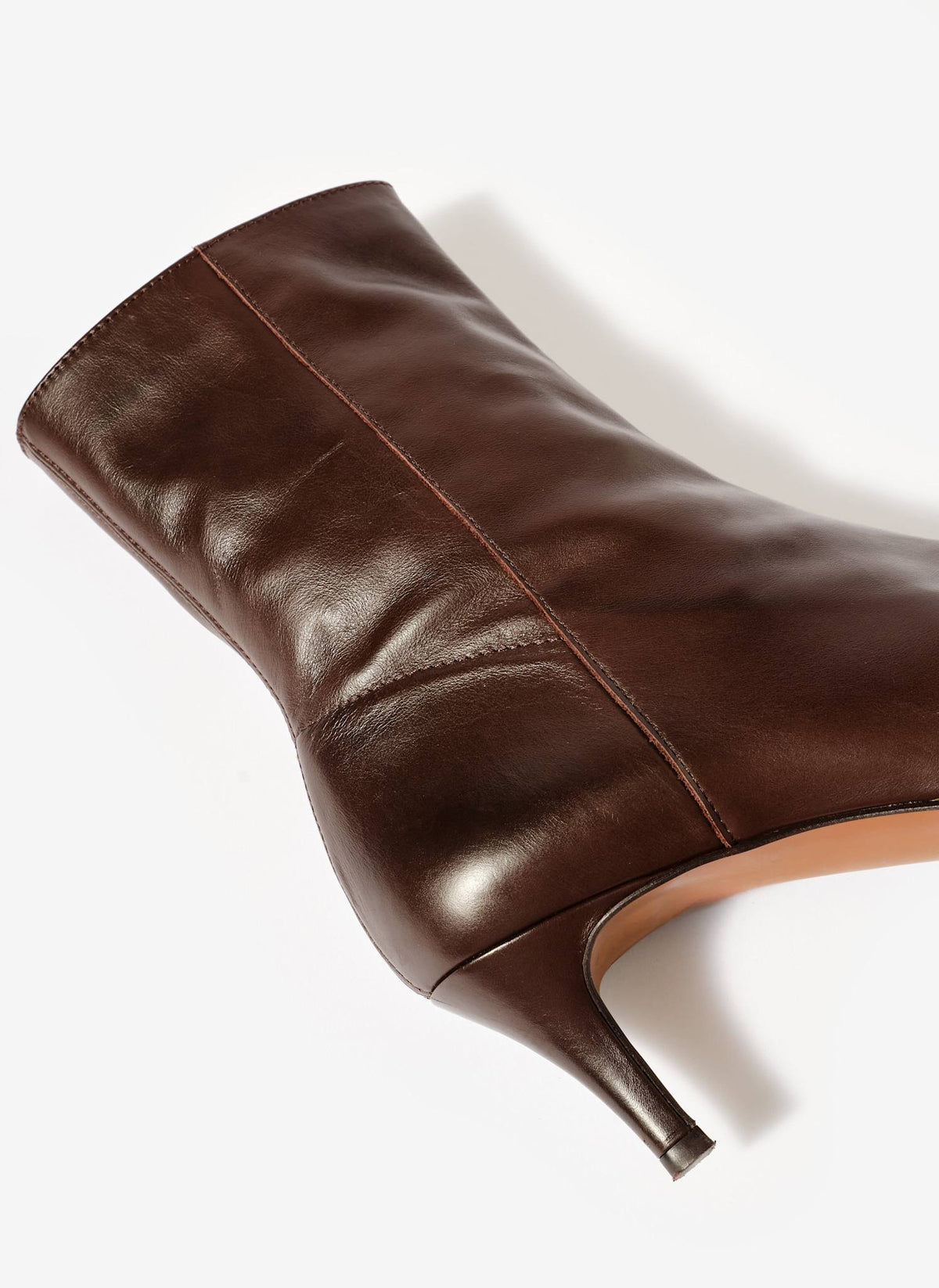 Brown leather ankle boot on a white background