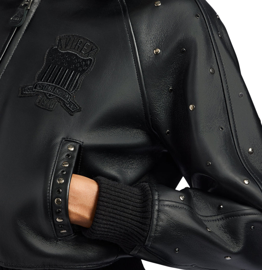 Studded pointed leather collar on women’s black Avirex jacket