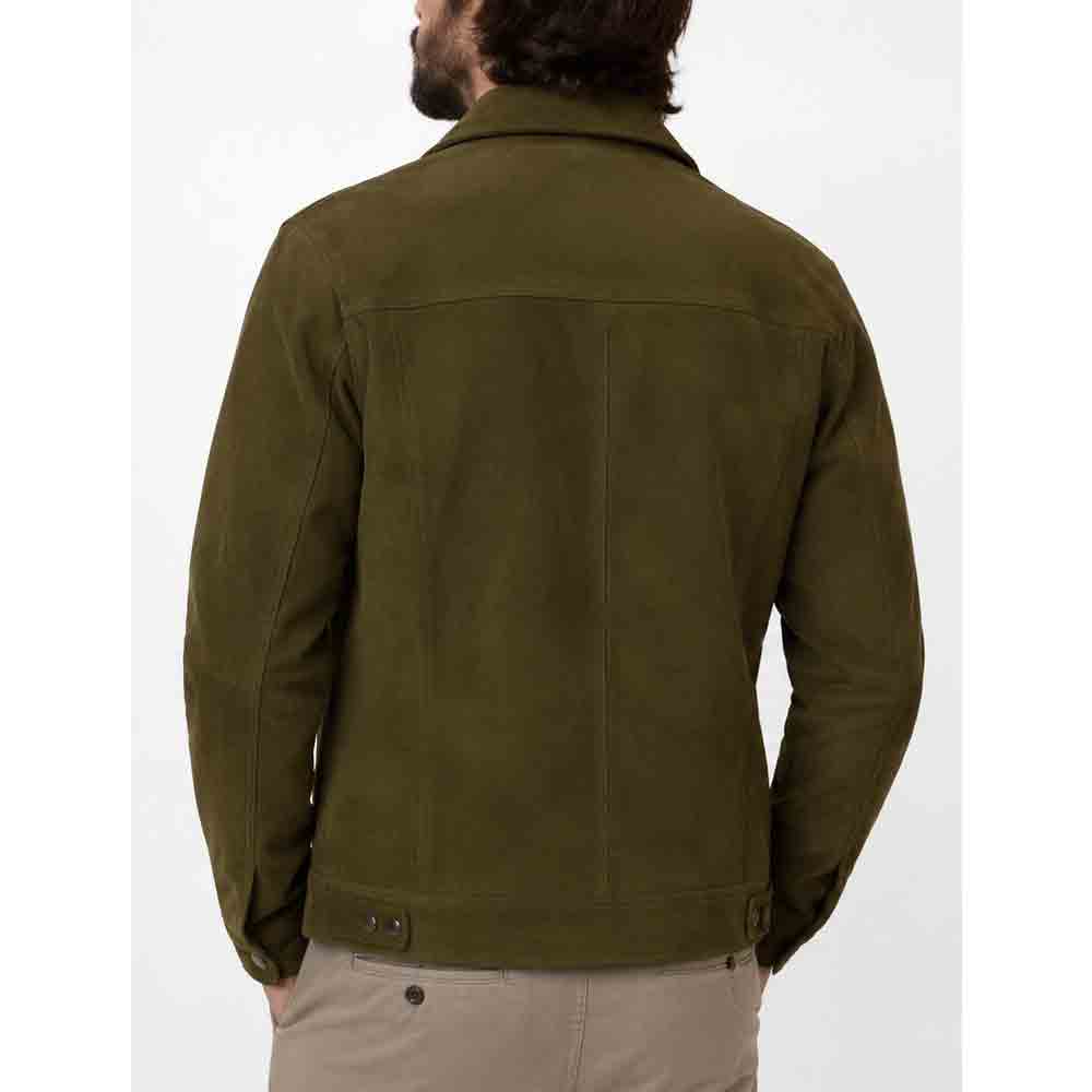 A man viewed from the back wearing an olive green suede jacket and beige trousers, set against a plain white studio background.
