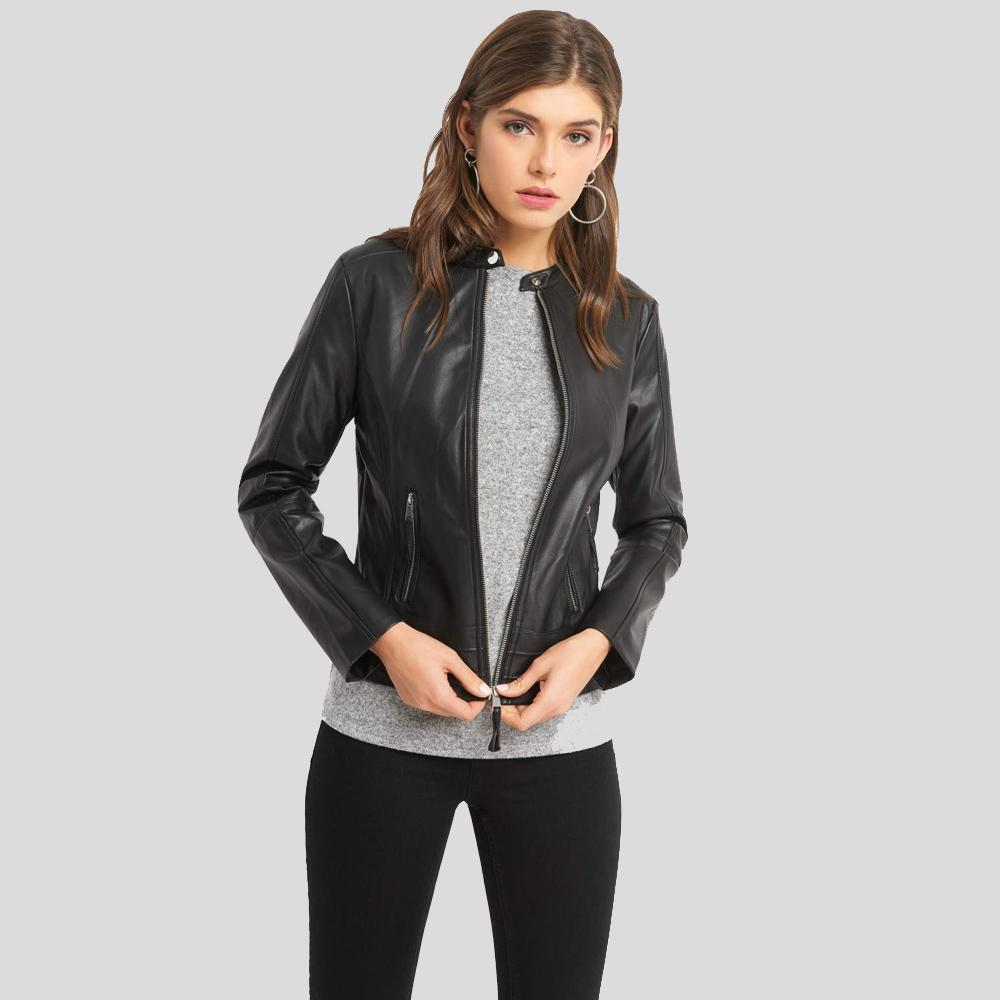 Woman wearing a black leather jacket on a gray background