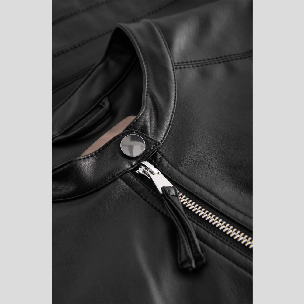 Close-up of a black leather jacket with a zipper and button on a light gray background