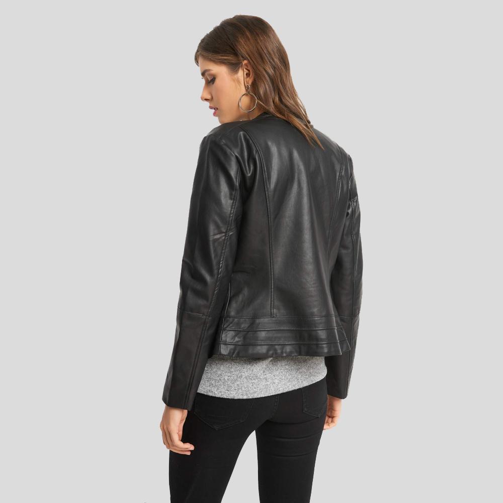 Woman wearing a black leather jacket on a gray background