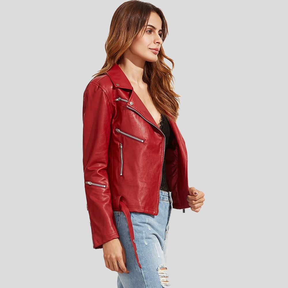 Woman wearing a red leather jacket on a light gray background