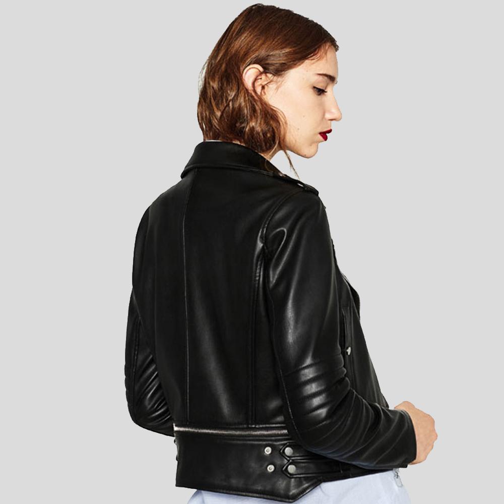 Woman wearing a black leather jacket on a light gray background