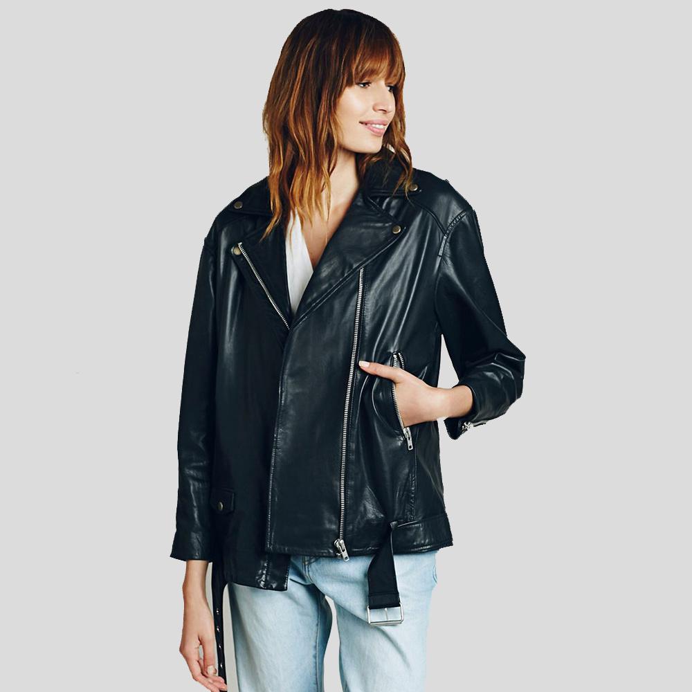 Woman wearing a black leather jacket on a plain background