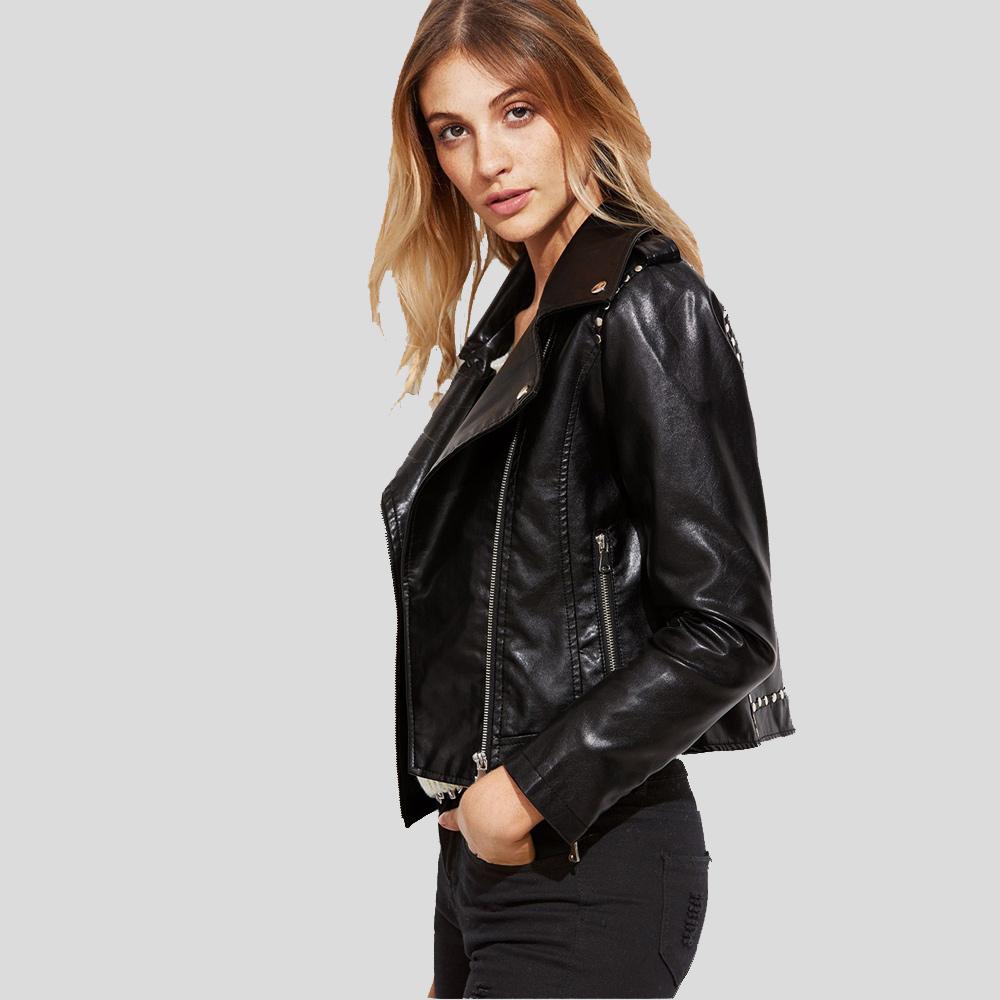 Woman wearing a black leather jacket on a gray background
