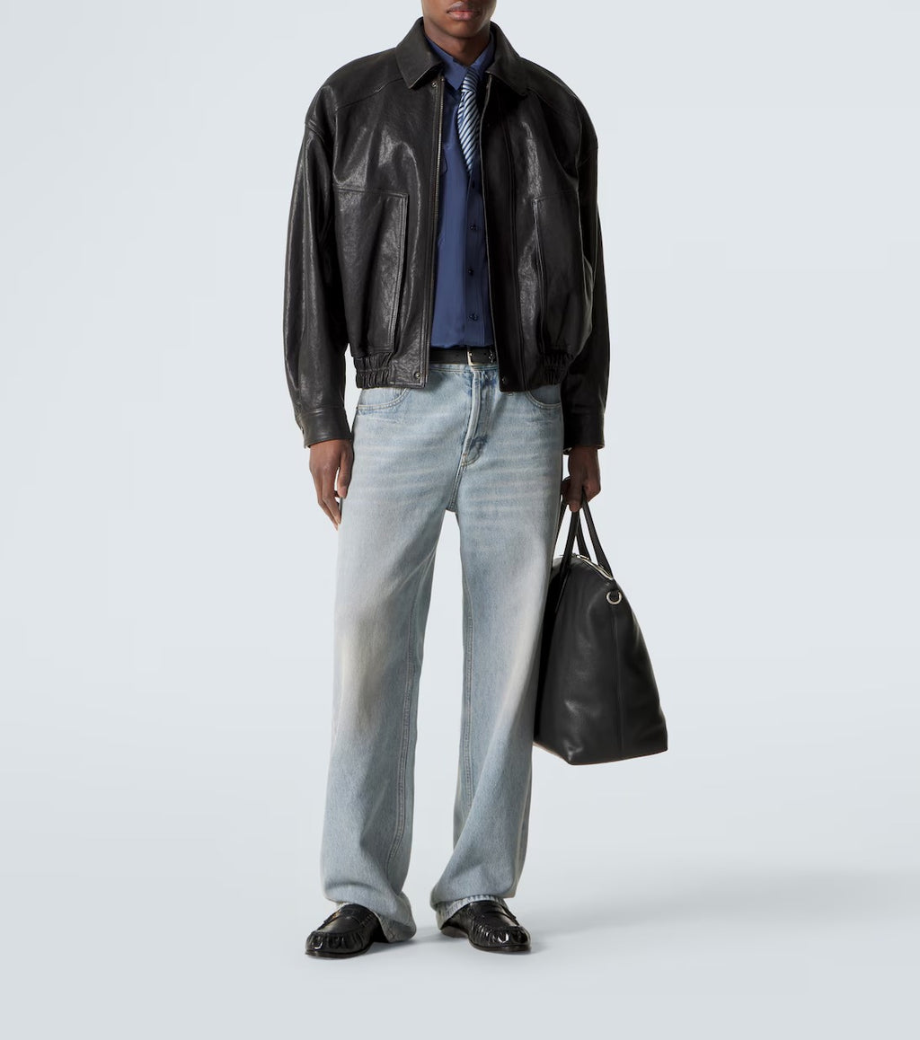 man standing wearing black bomber jacket