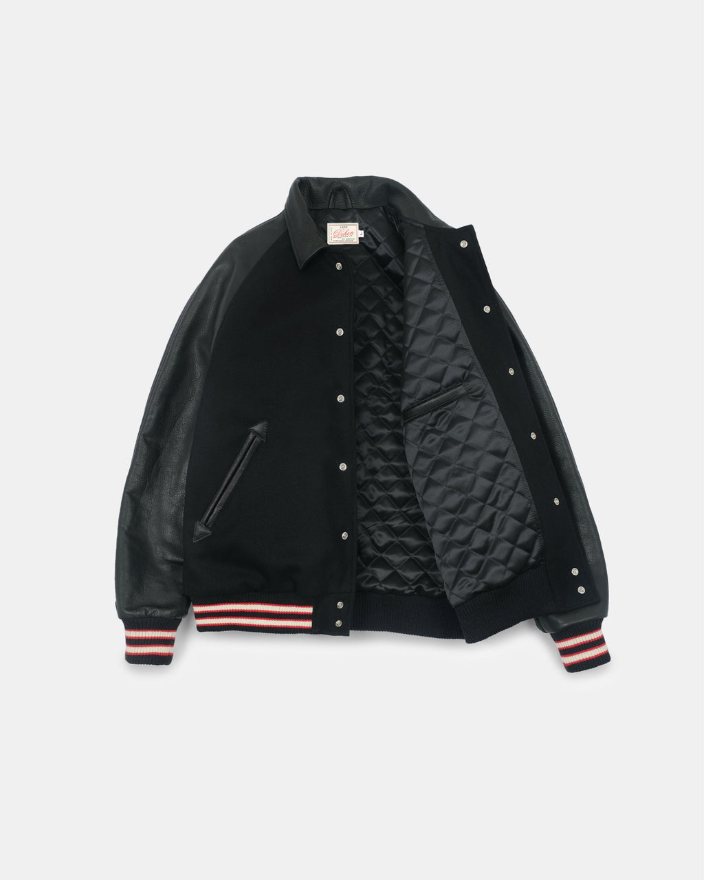 A black varsity-style bomber jacket with a quilted black interior lining, featuring striped ribbed cuffs in red, white, and black.