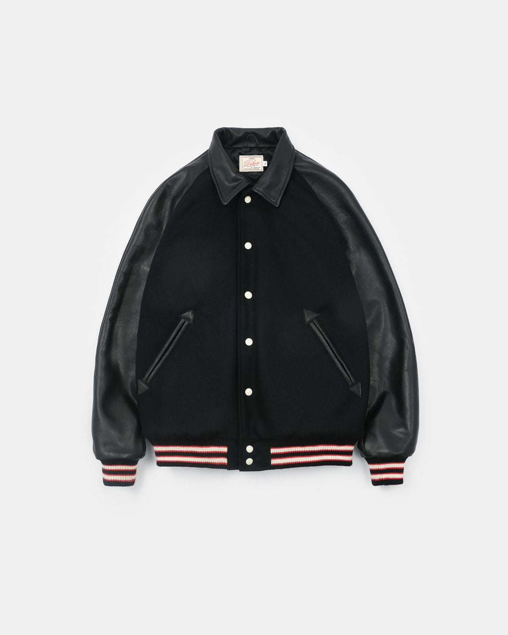 Black varsity jacket with leather sleeves on a light gray background