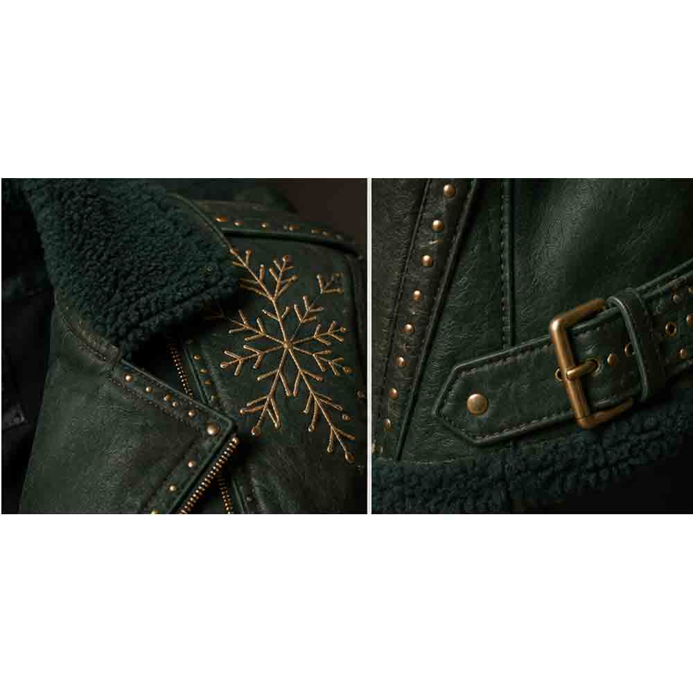 Close-up detail of a dark green leather jacket with a matching green sherpa lining. The left panel shows a gold embroidered snowflake on the chest, and the right panel shows a brass-tone buckle detail on the belt strap.