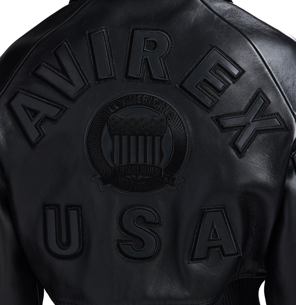 Tonal embroidered crest on black Avirex jacket back