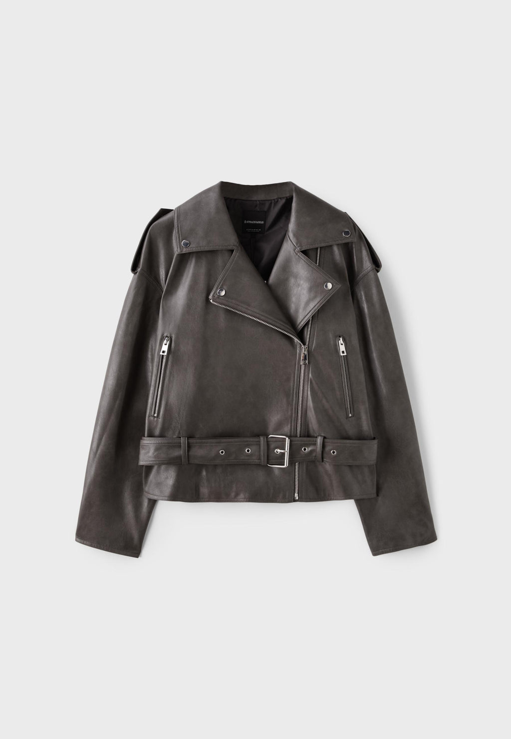 A dark brown leather moto jacket with silver hardware, featuring an asymmetrical zipper, shoulder epaulets, zippered chest pockets, and a matching belt with a silver buckle.