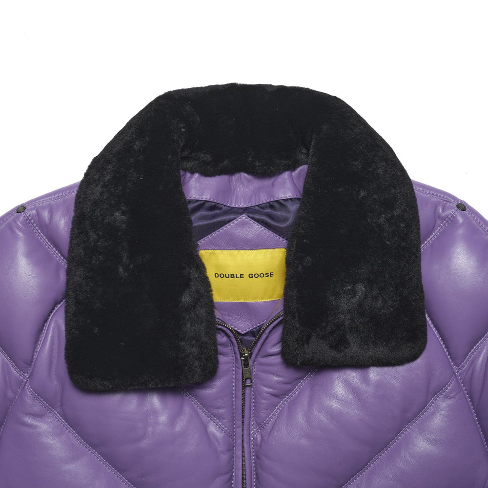 Close-up of a purple quilted puffer jacket with a thick black faux-fur collar and a yellow Double Goose neck label.