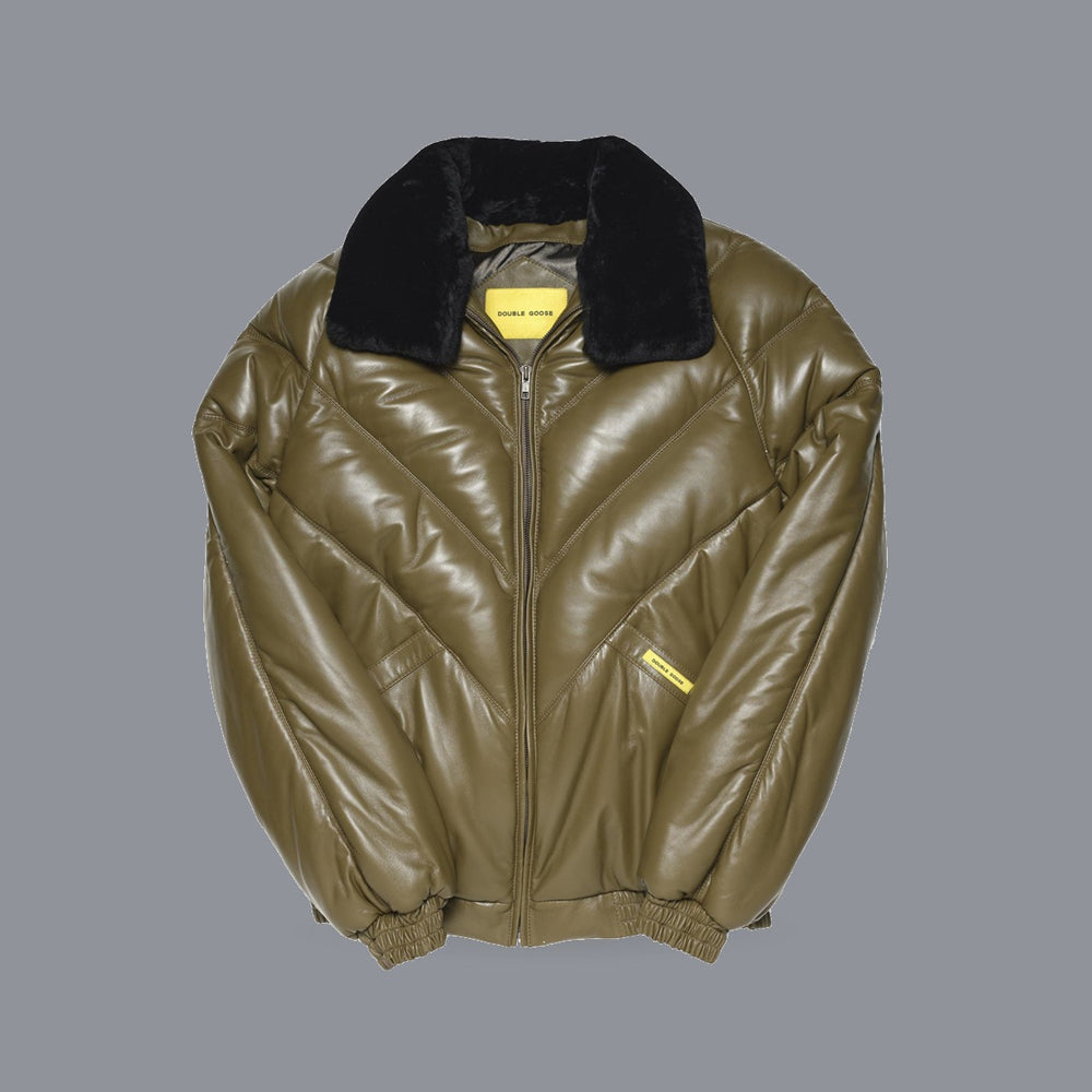 An olive green glossy puffer jacket with a black fur collar, shown flat against a solid gray background.